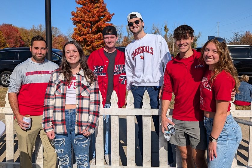 2024 Homecoming, group of young alumni at the Alumni Homecoming Tailgate